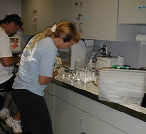 Processing microbiology samples at sea © USGS/Cheryl Morrison
